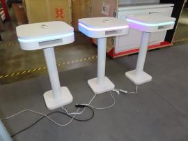 (3) Modified MOD-1463 Bistro Tables with RGB Lights, Cubby, and Powder-coated Post and (1) MOD-1729 Reception Counter with Locking Storage, RGB Lights, and Vinyl Graphic -- View 2